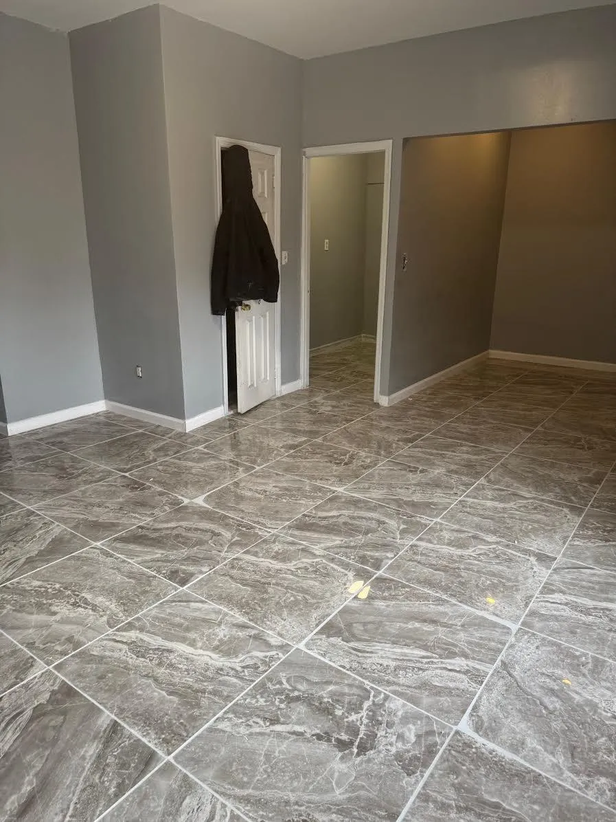 Spare room with marble finish floor and baseboards Spare room with marble finish floor and baseboards