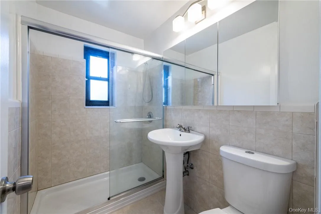 Updated hall bath with stall shower and sliding glass doors. Updated hall bath with stall shower and sliding glass doors.