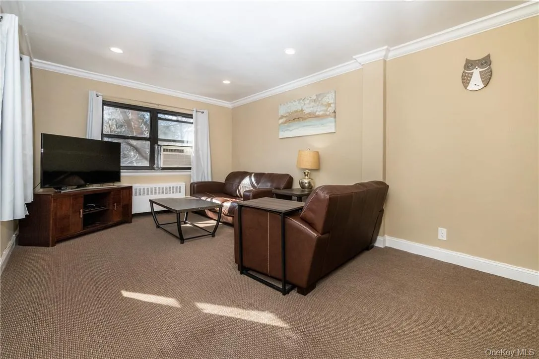 Spacious living room with high hats and double windows. Spacious living room with high hats and double windows.