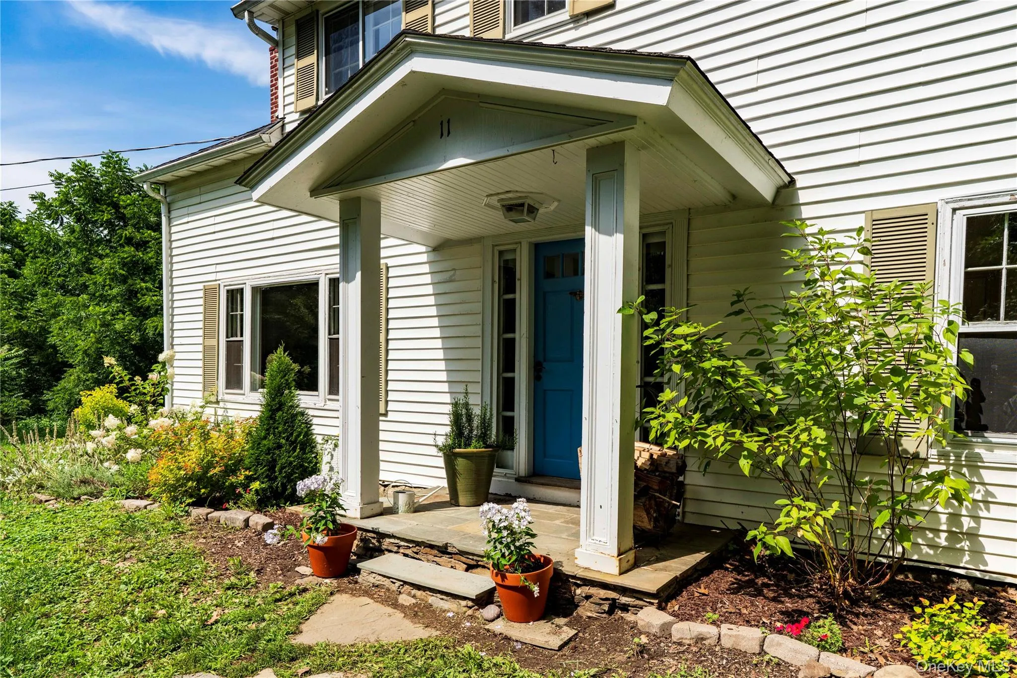 Covered Front Porch with Gardens Covered Front Porch with Gardens