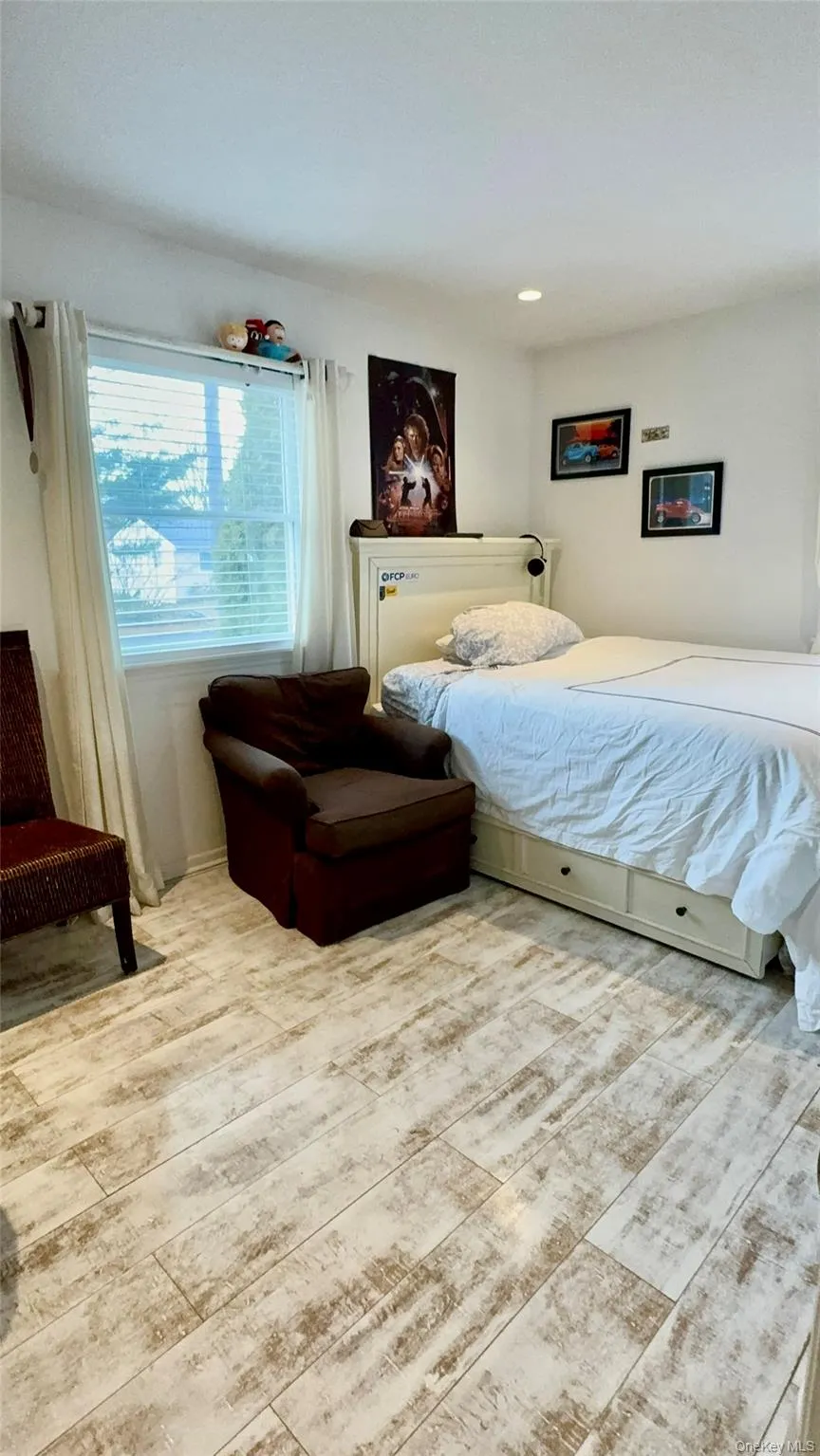 Bedroom with wood finished floors