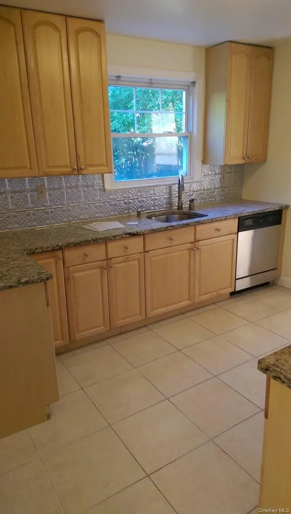 Spacious, modern, fully-renovated kitchen with granite countertops, stainless appliances, and lots of cabinetry Spacious, modern, fully-renovated kitchen with granite countertops, stainless appliances, and lots of cabinetry
