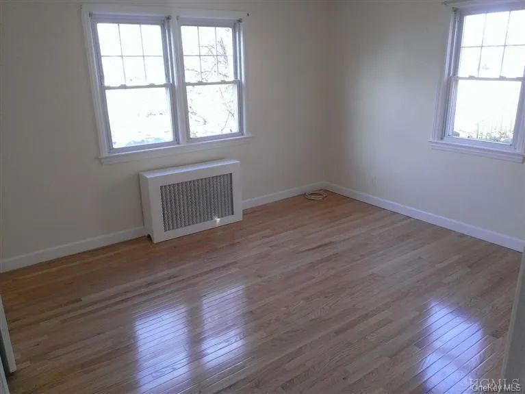 This is the first of two spacious bedrooms on ground floor, both with new (2013) hardwood flooring. This is the first of two spacious bedrooms on ground floor, both with new (2013) hardwood flooring.