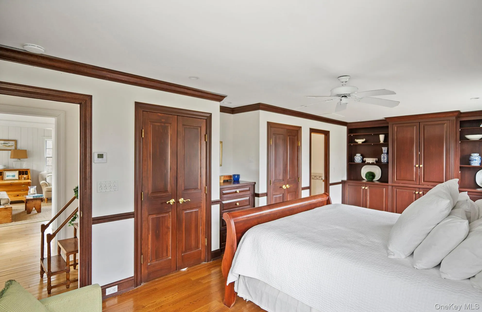 Primary Bedroom suite featuring closets and built-in cabinetry Primary Bedroom suite featuring closets and built-in cabinetry