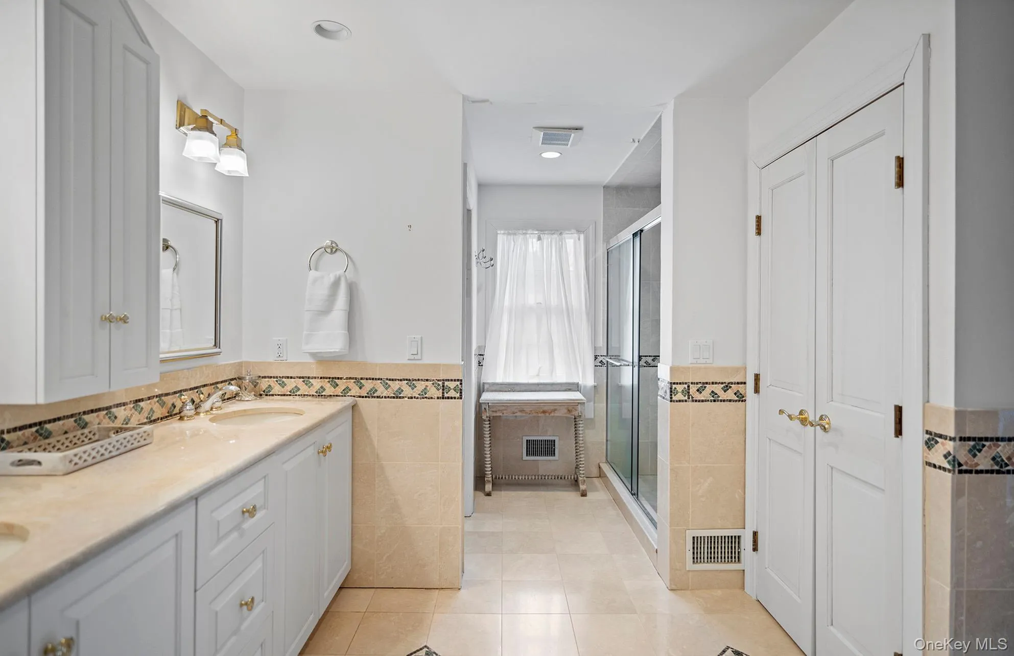 Primary Bathroom featuring double vanity, separate shower and private water closet Primary Bathroom featuring double vanity, separate shower and private water closet