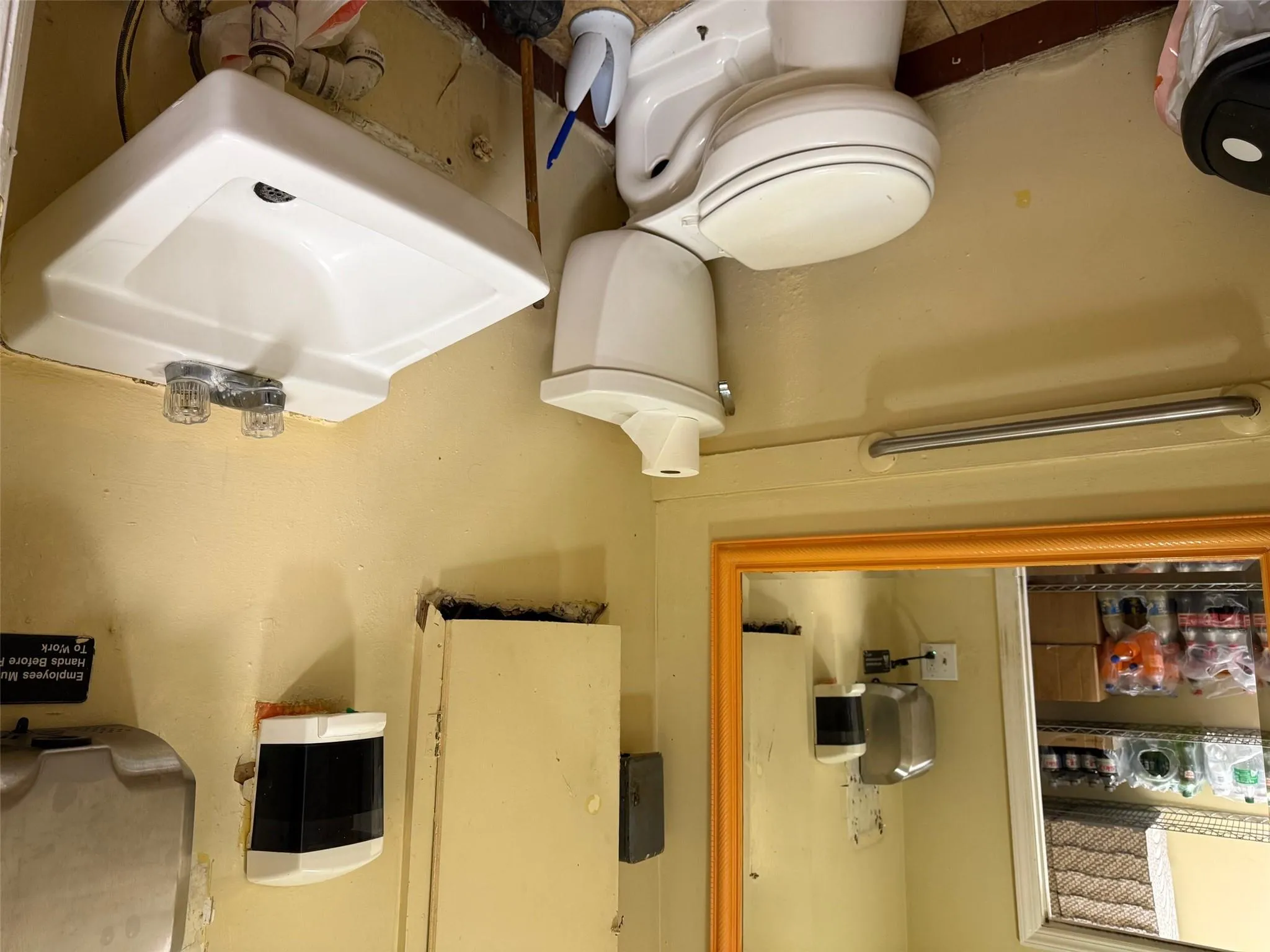 Half bath featuring a sink and toilet Half bath featuring a sink and toilet