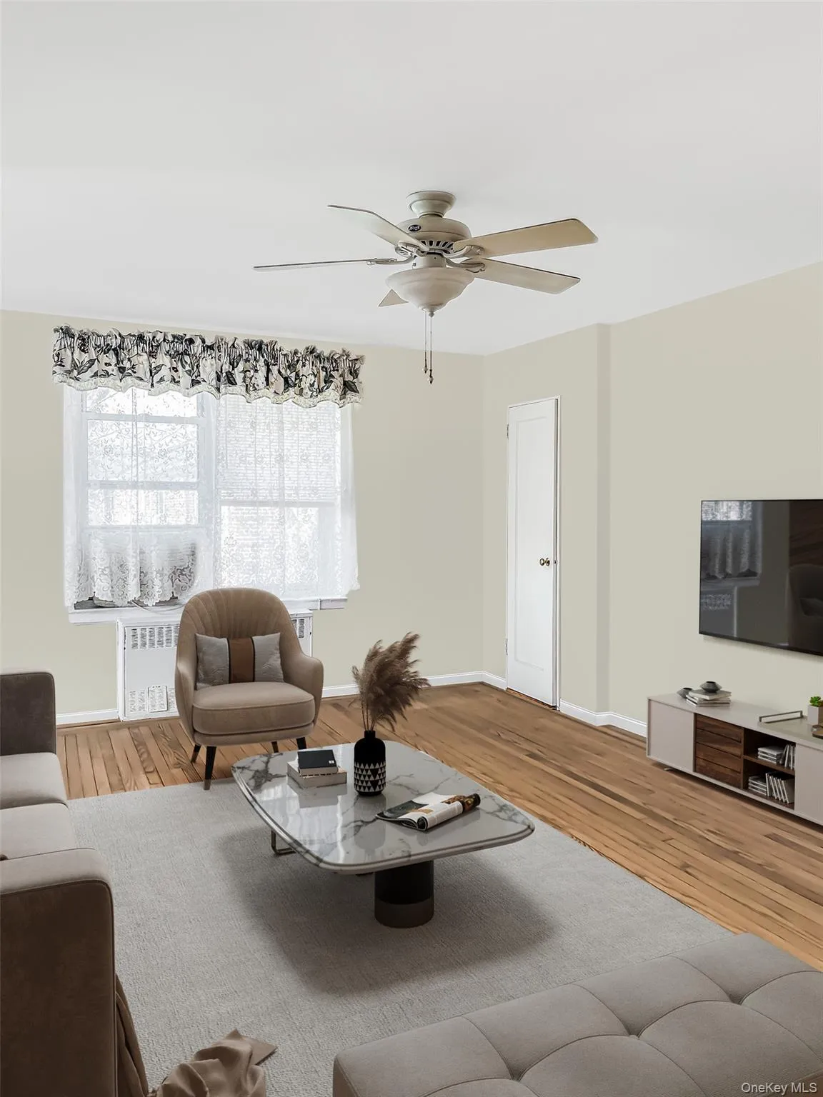 STAGED: Living room with wood finished floors, a ceiling fan, and radiator STAGED: Living room with wood finished floors, a ceiling fan, and radiator