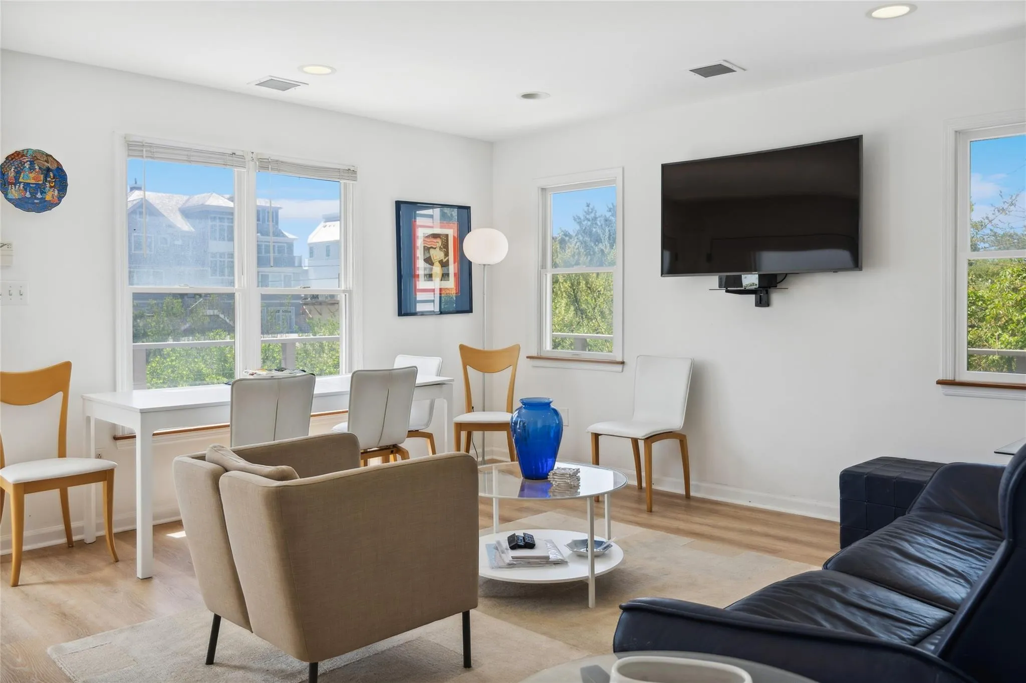 Living room featuring plenty of natural light and visible vents Living room featuring plenty of natural light and visible vents