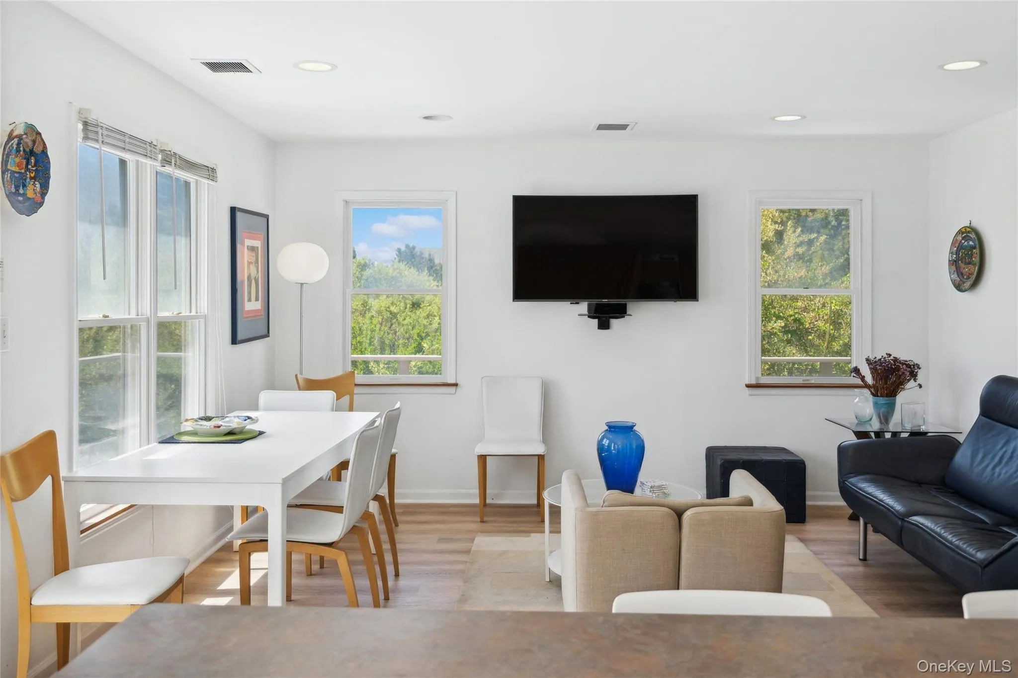 Dining area featuring light wood-type flooring, plenty of natural light, recessed lighting, and visible vents Dining area featuring light wood-type flooring, plenty of natural light, recessed lighting, and visible vents