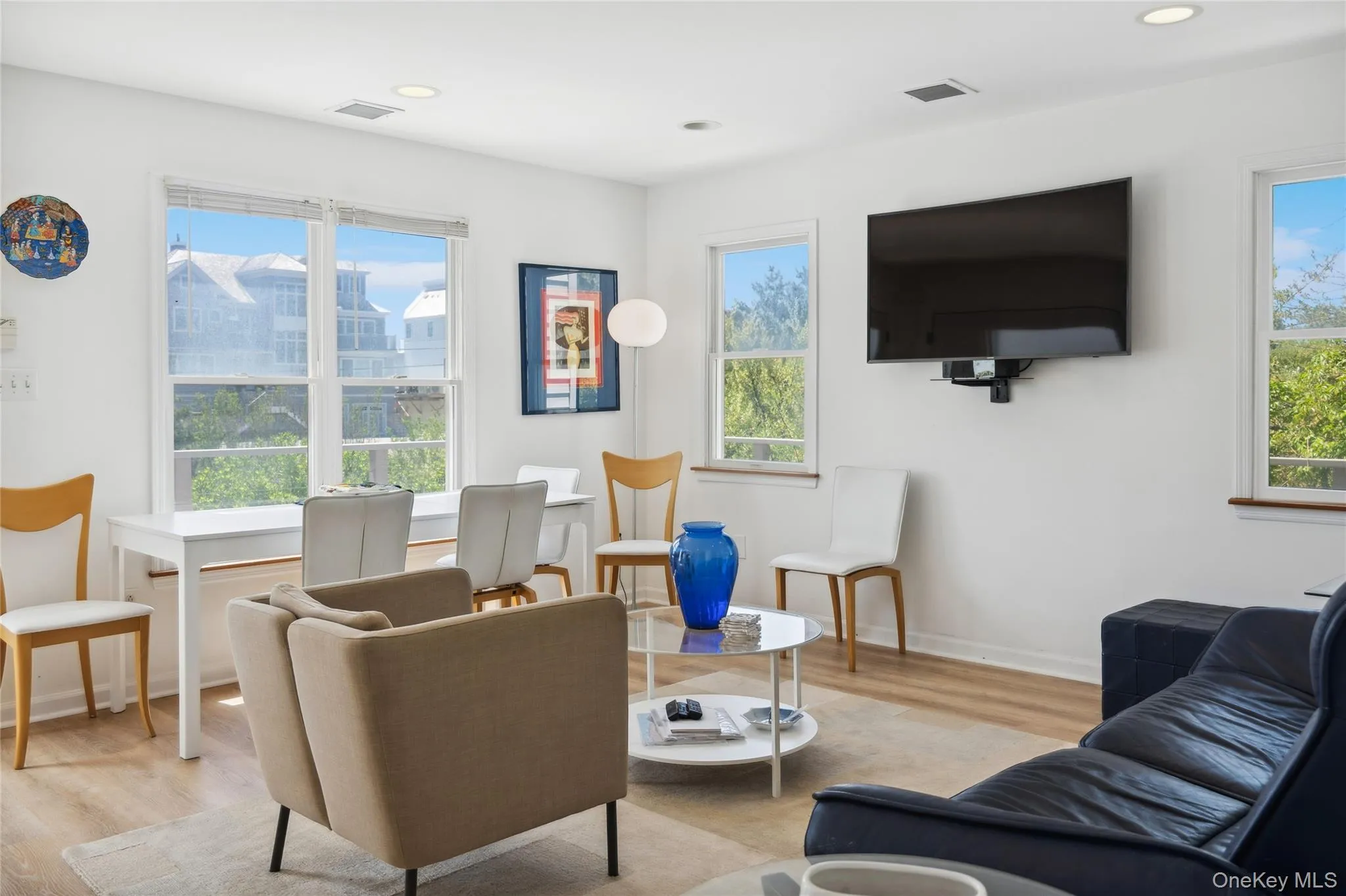 Living room featuring plenty of natural light and visible vents Living room featuring plenty of natural light and visible vents