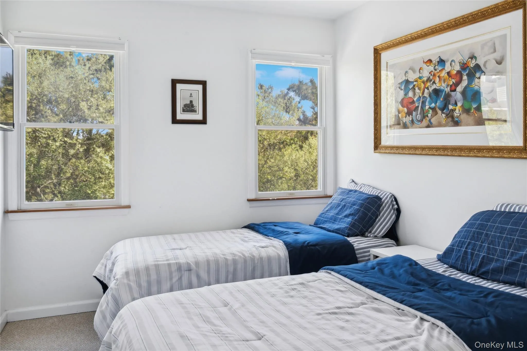 Bedroom featuring carpet flooring and baseboards Bedroom featuring carpet flooring and baseboards