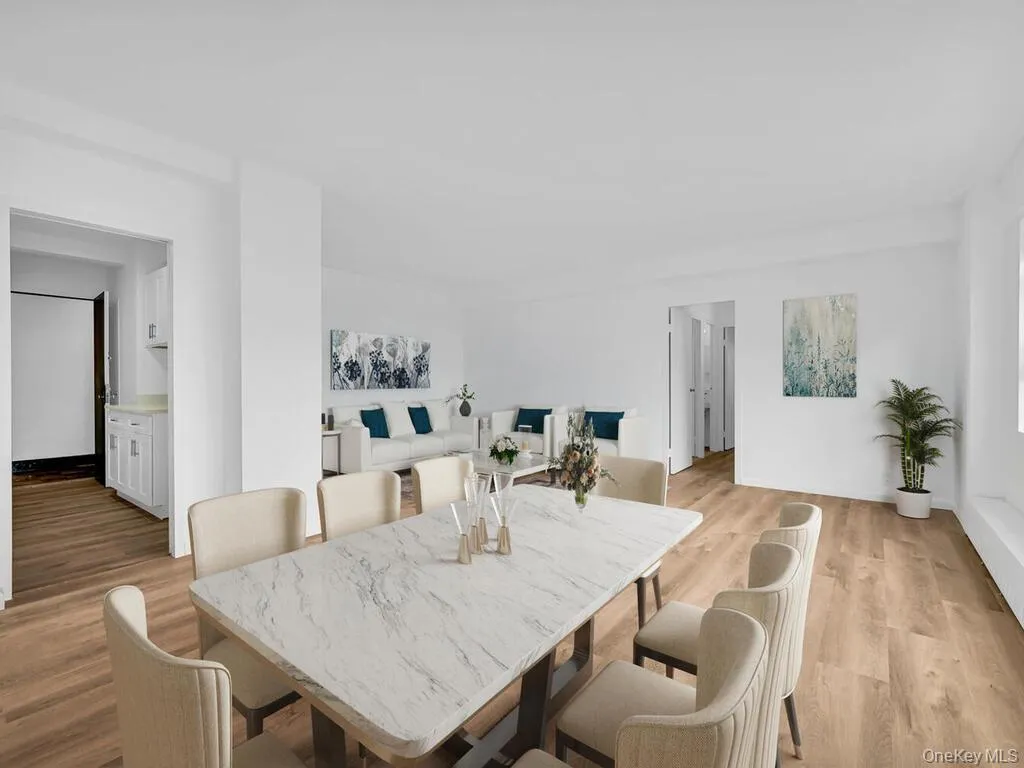 Virtually staged Dining space with light wood-type flooring Virtually staged Dining space with light wood-type flooring