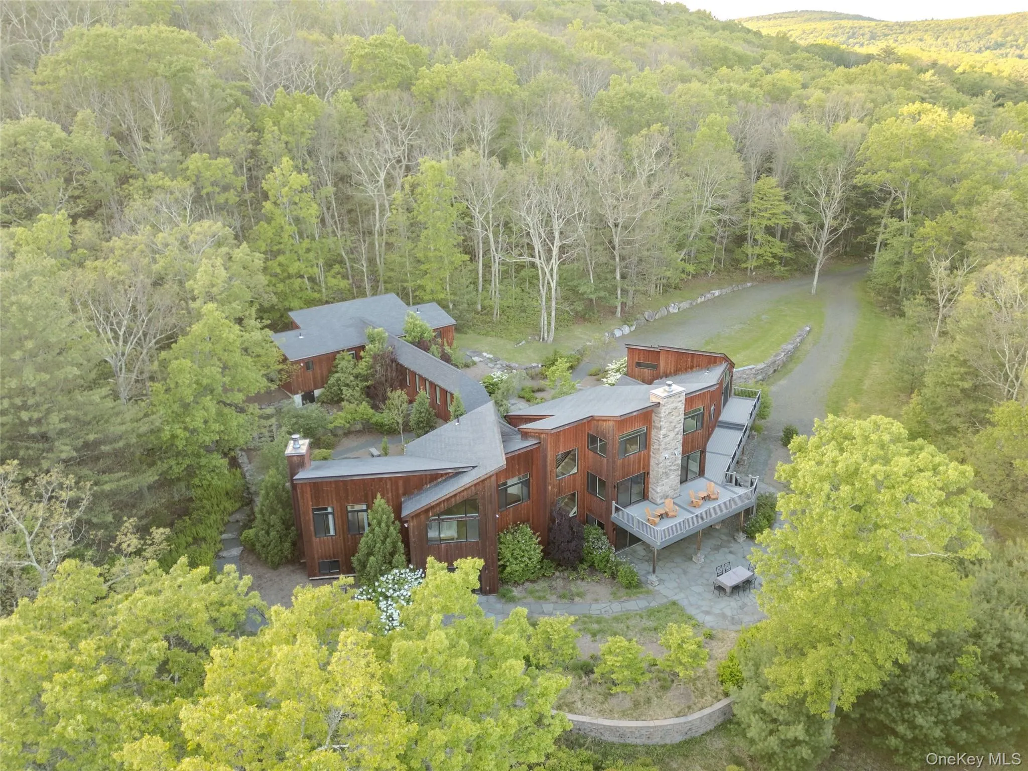 Aerial view of property and surrounding area featuring a forest Aerial view of property and surrounding area featuring a forest