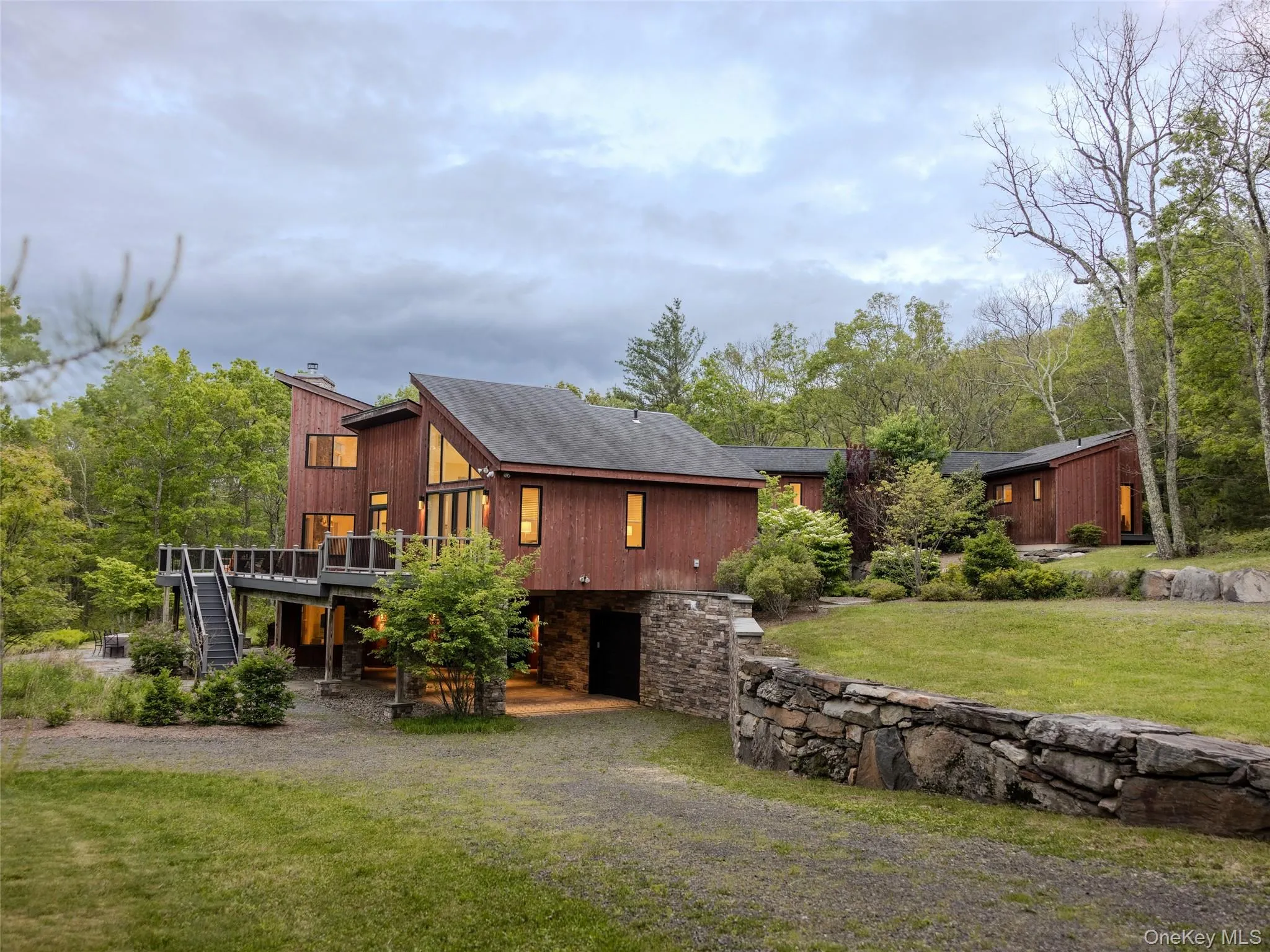 Rear view of property with stairs, a wooden deck, and a yard Rear view of property with stairs, a wooden deck, and a yard