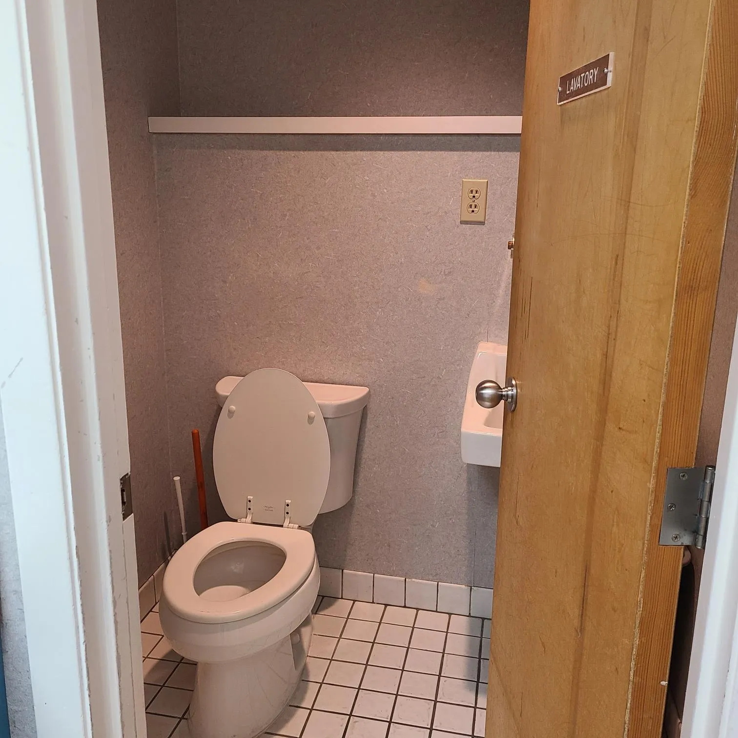 Bathroom with tile patterned floors, toilet, and baseboards Bathroom with tile patterned floors, toilet, and baseboards