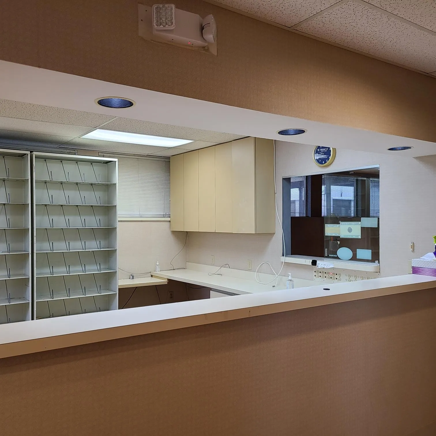 Kitchen featuring open shelves, light countertops, and a paneled ceiling Kitchen featuring open shelves, light countertops, and a paneled ceiling