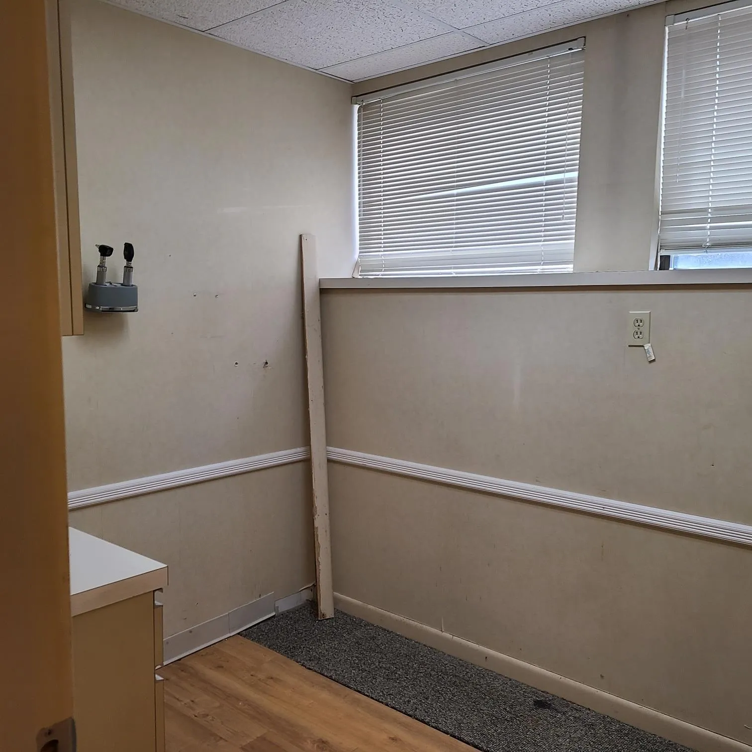 Unfurnished room featuring a paneled ceiling and wood finished floors Unfurnished room featuring a paneled ceiling and wood finished floors