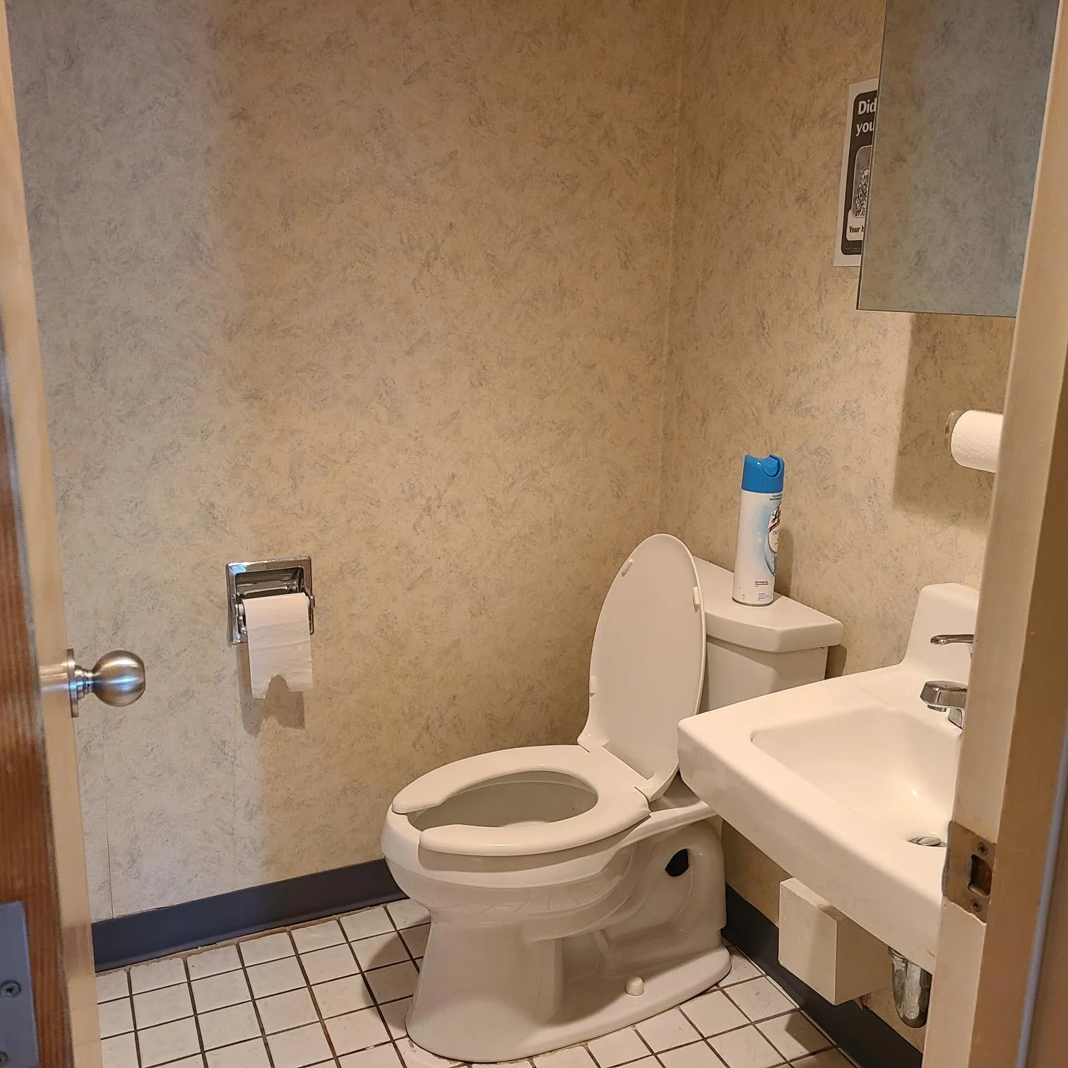 Half bathroom featuring tile patterned floors, a sink, toilet, and baseboards Half bathroom featuring tile patterned floors, a sink, toilet, and baseboards