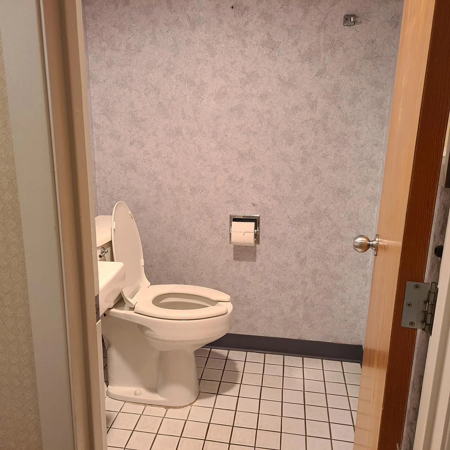 Bathroom with baseboards, toilet, and tile patterned flooring Bathroom with baseboards, toilet, and tile patterned flooring