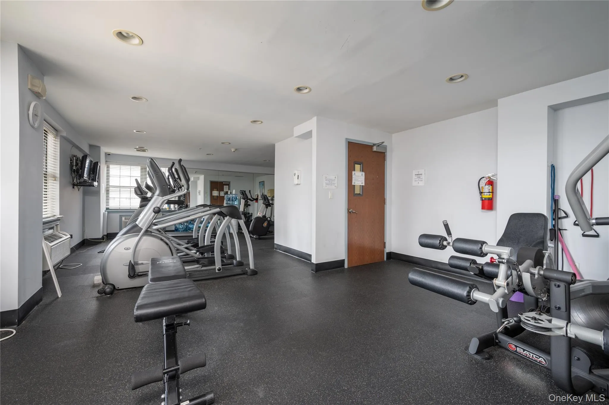 Workout area featuring baseboards and recessed lighting Workout area featuring baseboards and recessed lighting