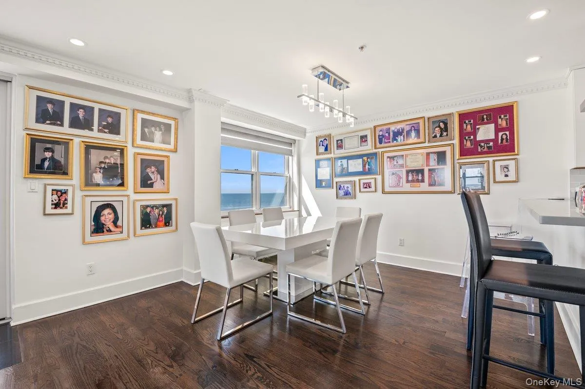 Dining area with wood finished floors, baseboards, ornamental molding, and recessed lighting Dining area with wood finished floors, baseboards, ornamental molding, and recessed lighting