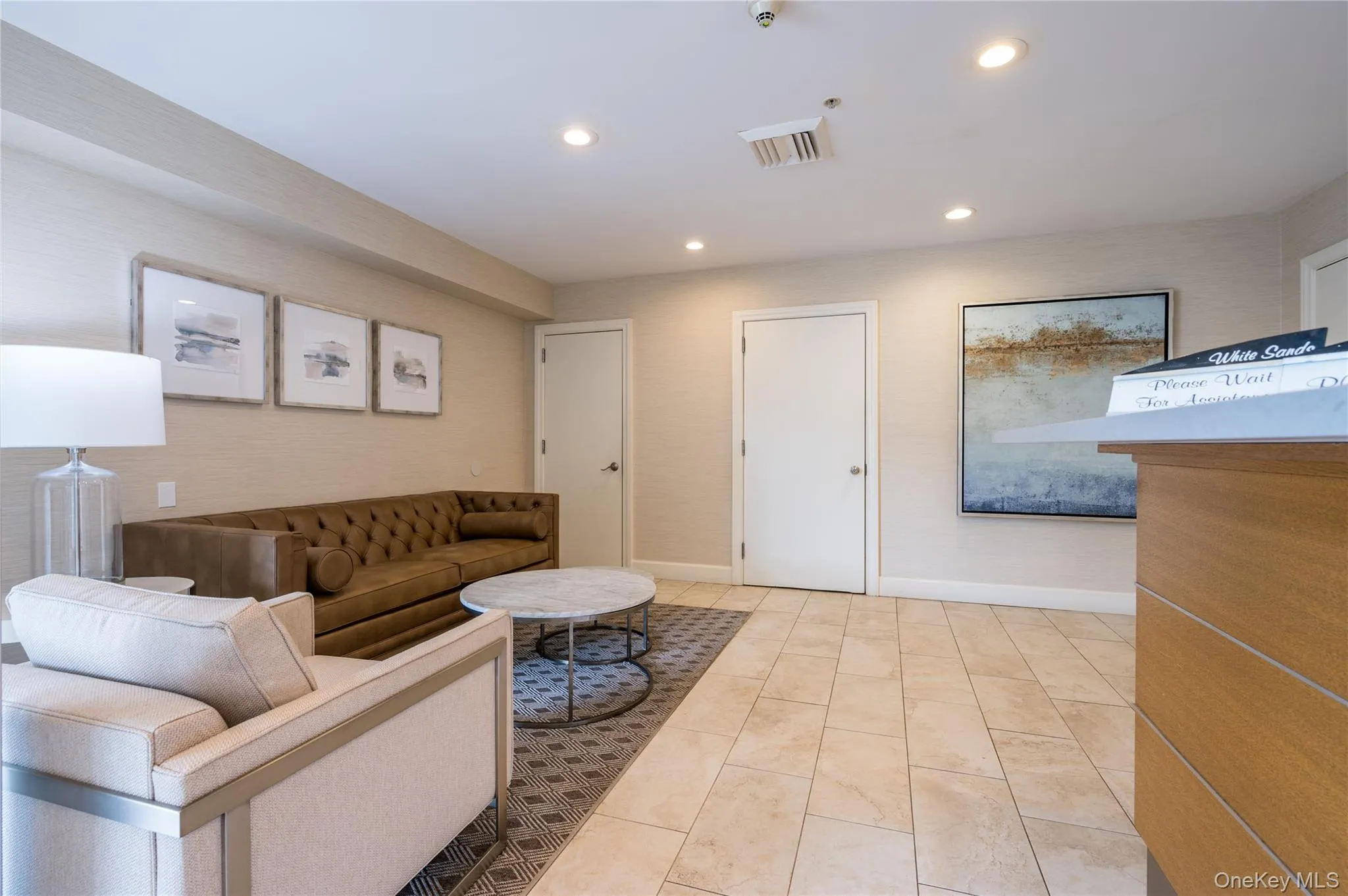 Living area with baseboards, visible vents, and recessed lighting Living area with baseboards, visible vents, and recessed lighting
