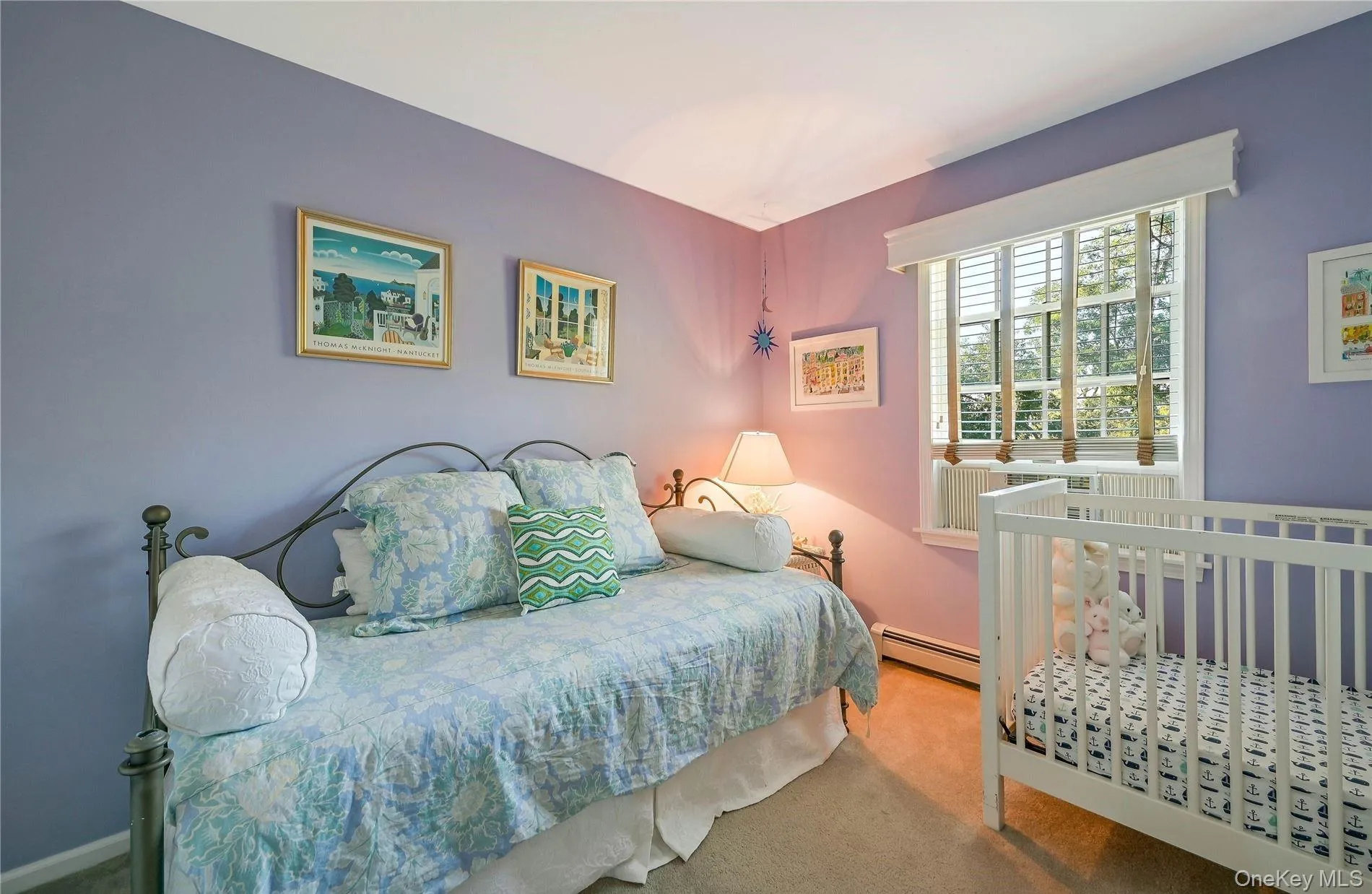 Bedroom featuring carpet and baseboard heating Bedroom featuring carpet and baseboard heating