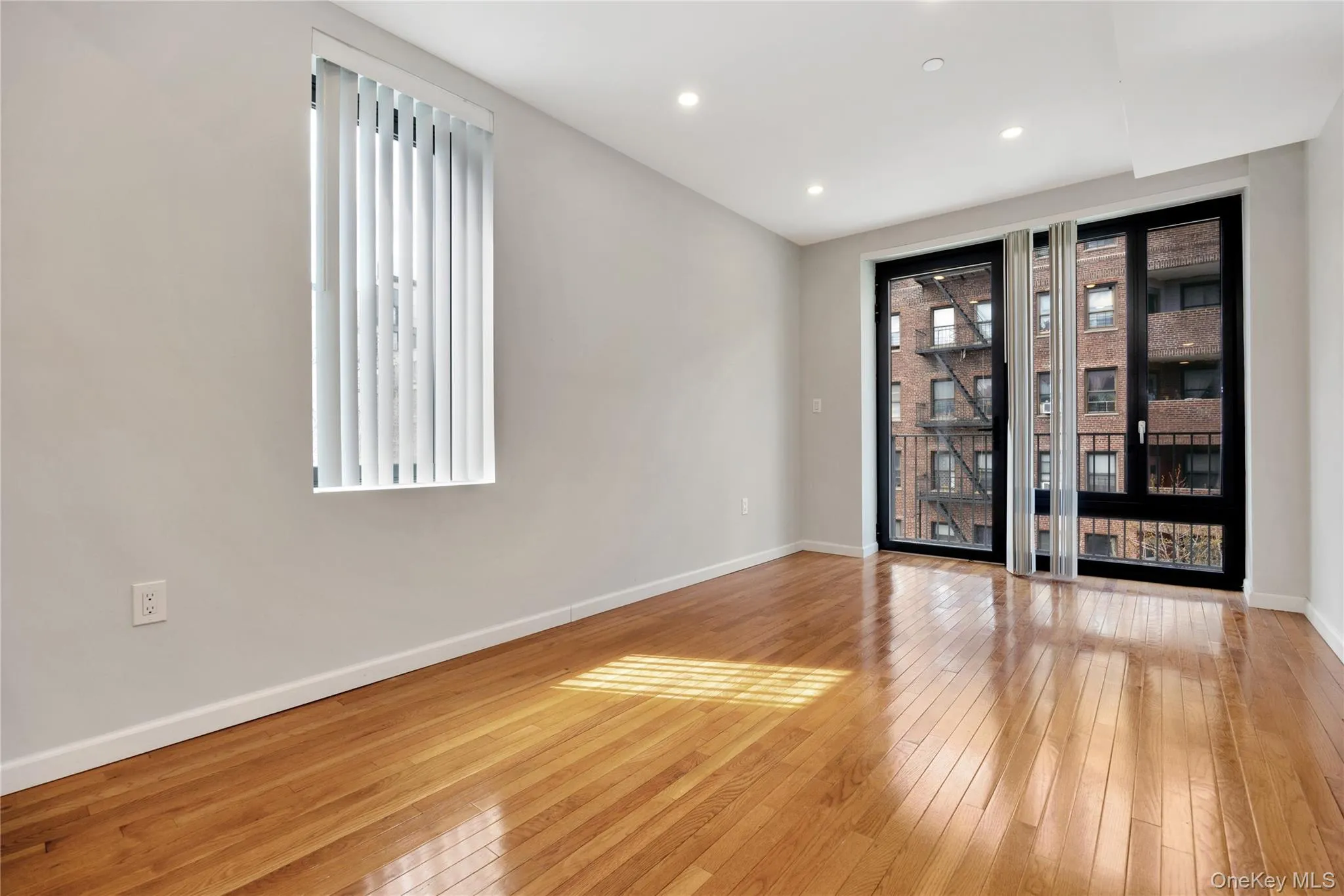 Spare room featuring baseboards, recessed lighting, and light wood-style floors Spare room featuring baseboards, recessed lighting, and light wood-style floors