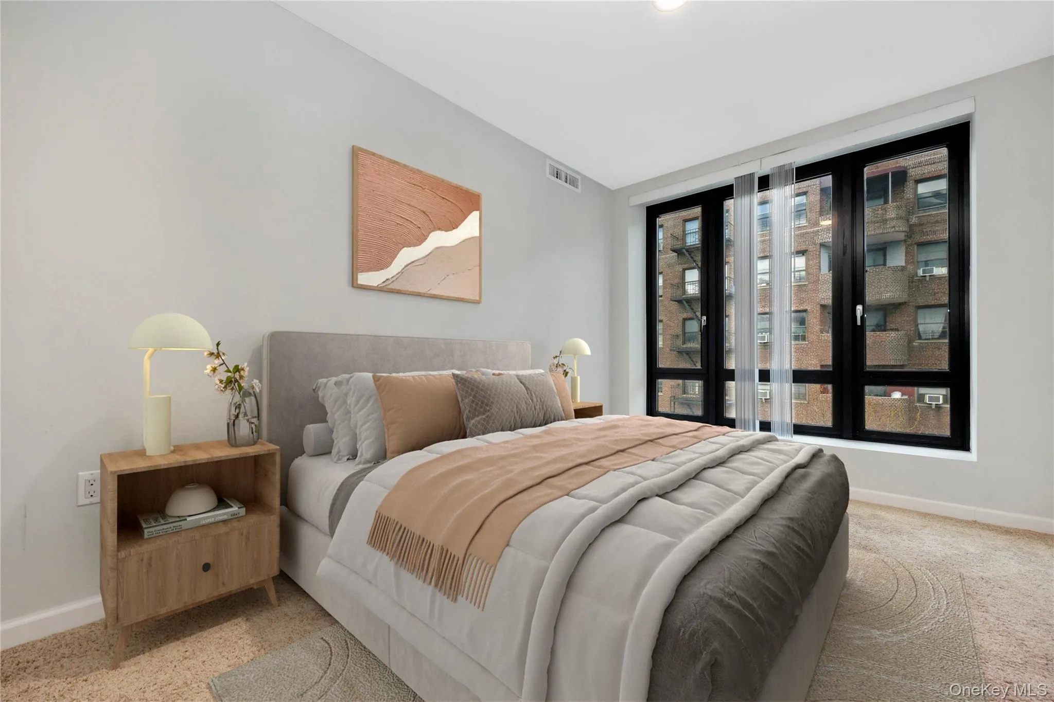 Bedroom featuring light carpet, visible vents, and baseboards Bedroom featuring light carpet, visible vents, and baseboards