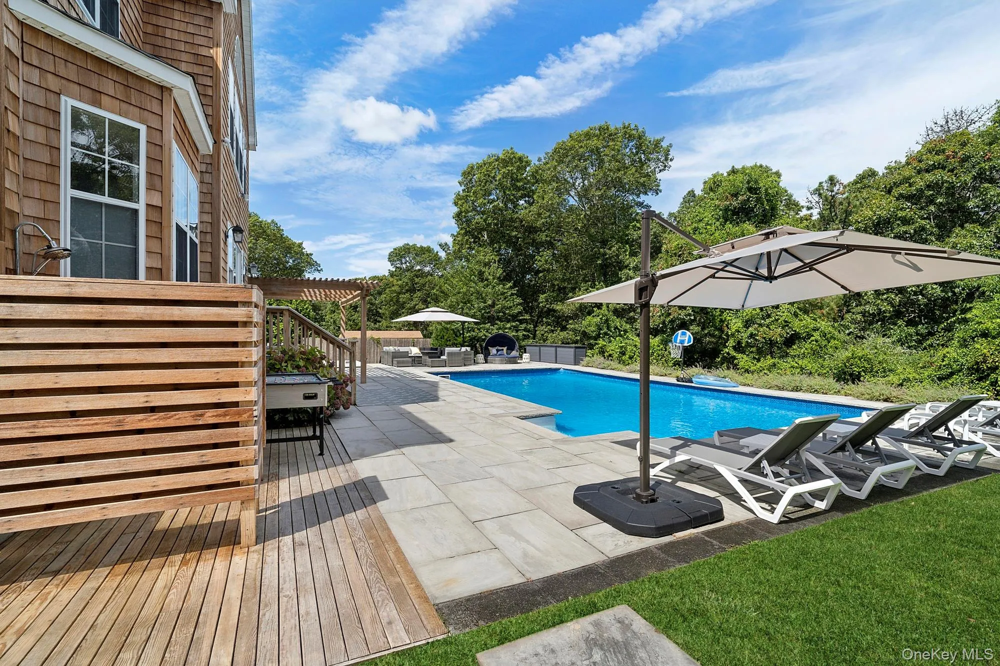 View of swimming pool with a patio and a deck View of swimming pool with a patio and a deck