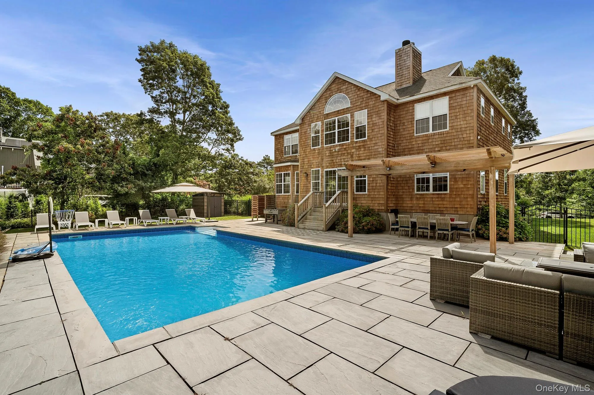 View of pool featuring outdoor lounge area, a patio, and outdoor dining space View of pool featuring outdoor lounge area, a patio, and outdoor dining space