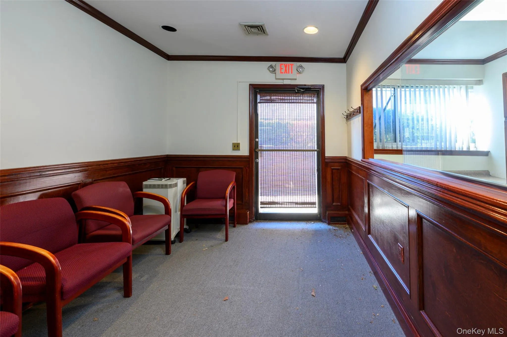 Living area with visible vents, wainscoting, crown molding, carpet floors, and recessed lighting Living area with visible vents, wainscoting, crown molding, carpet floors, and recessed lighting