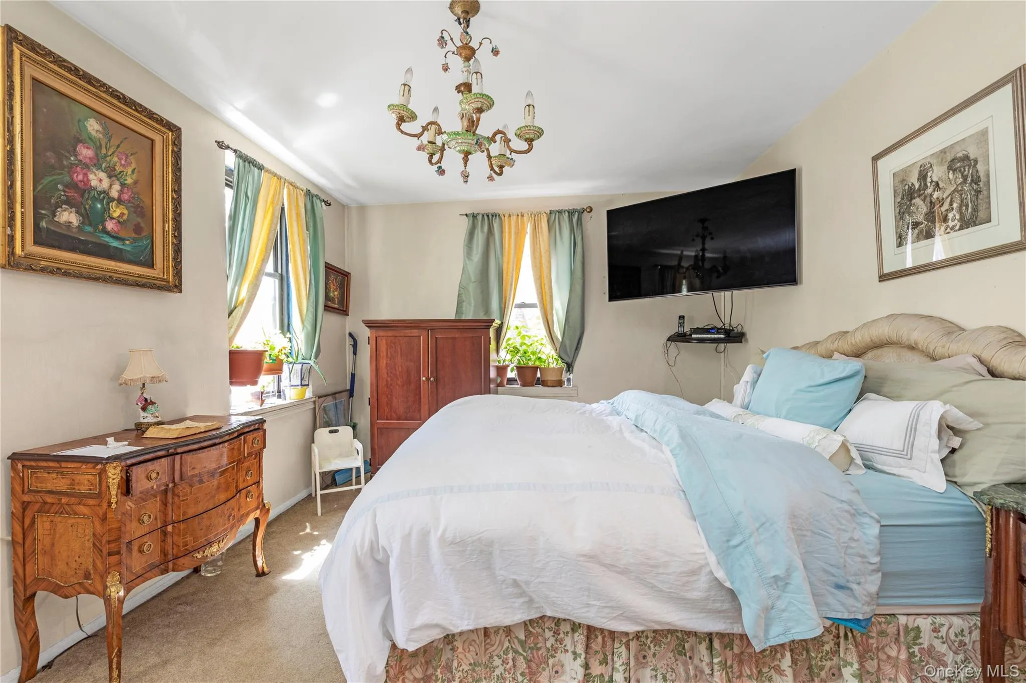 Bedroom with light colored carpet and baseboards Bedroom with light colored carpet and baseboards
