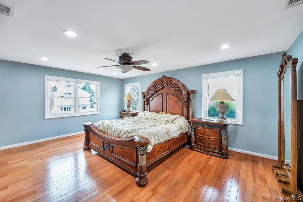 Bedroom featuring light wood-type flooring, baseboards, visible vents, and recessed lighting Bedroom featuring light wood-type flooring, baseboards, visible vents, and recessed lighting