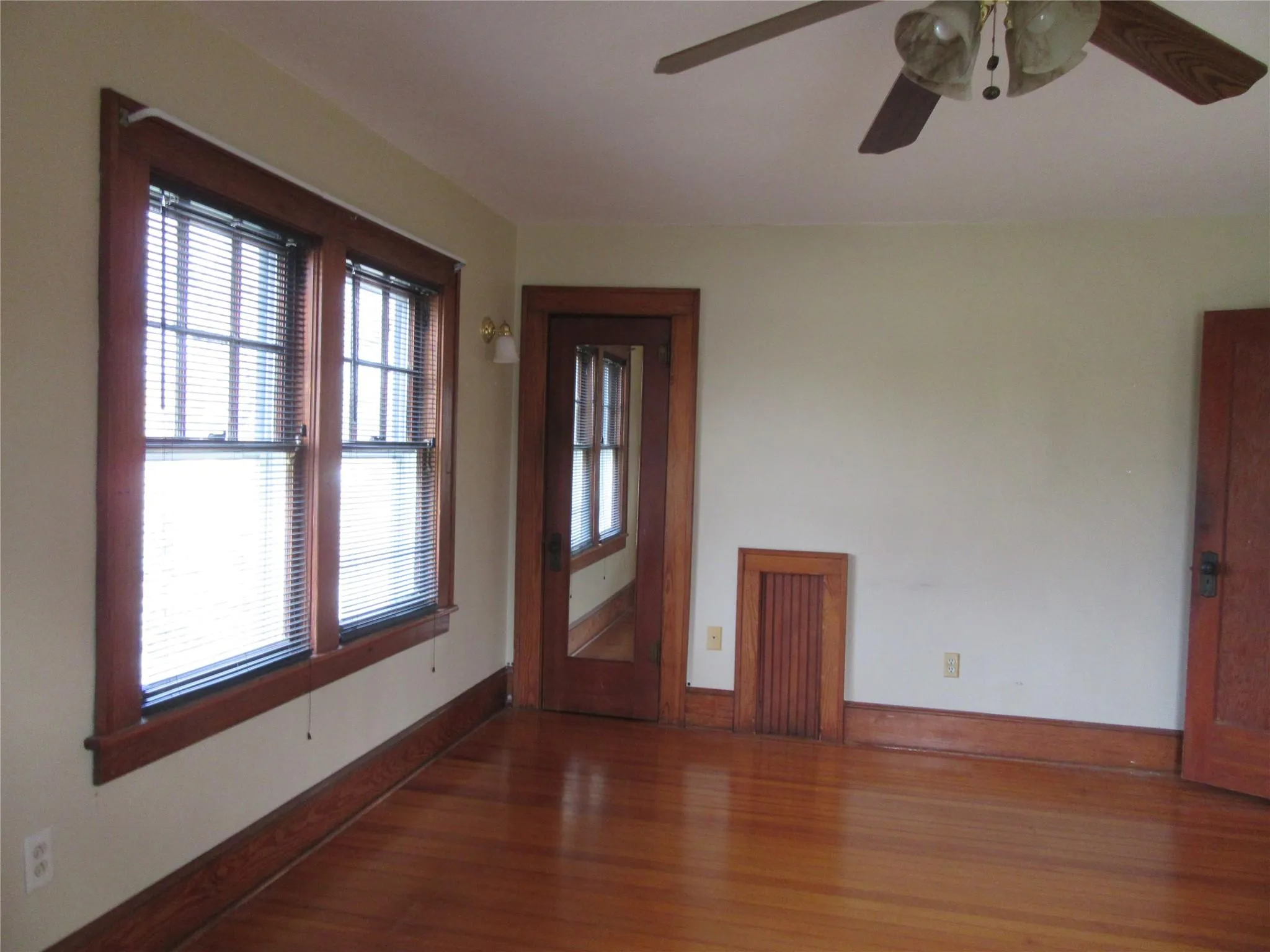 Entryway featuring wood finished floors, baseboards, and a ceiling fan Entryway featuring wood finished floors, baseboards, and a ceiling fan
