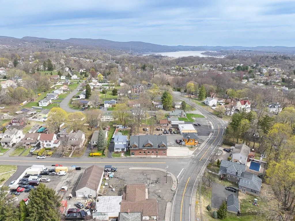 Birds eye view of property with a residential view and a mountain view Birds eye view of property with a residential view and a mountain view