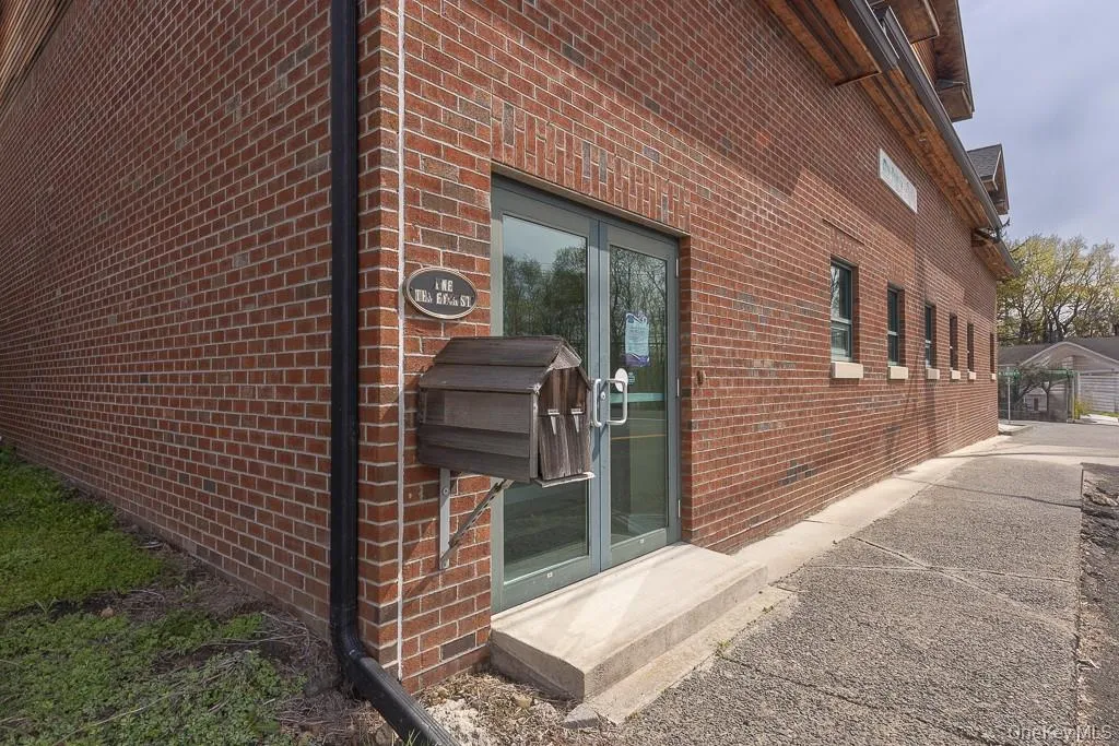 View of home\'s exterior with entry steps and brick siding View of home\'s exterior with entry steps and brick siding