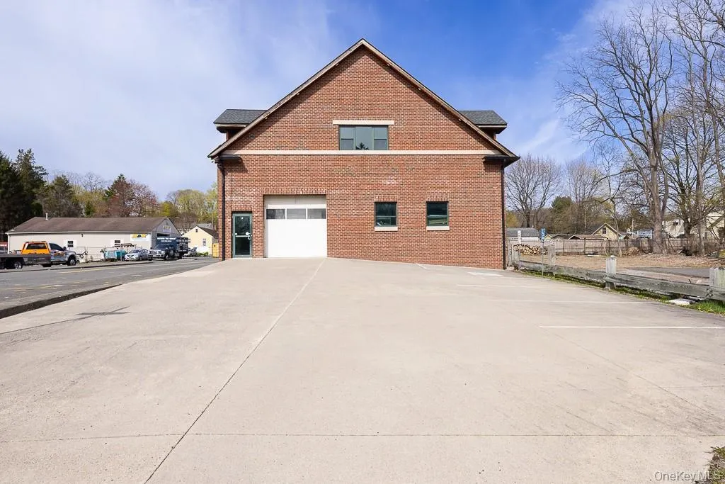 View of home\'s exterior with brick siding and an attached garage View of home\'s exterior with brick siding and an attached garage