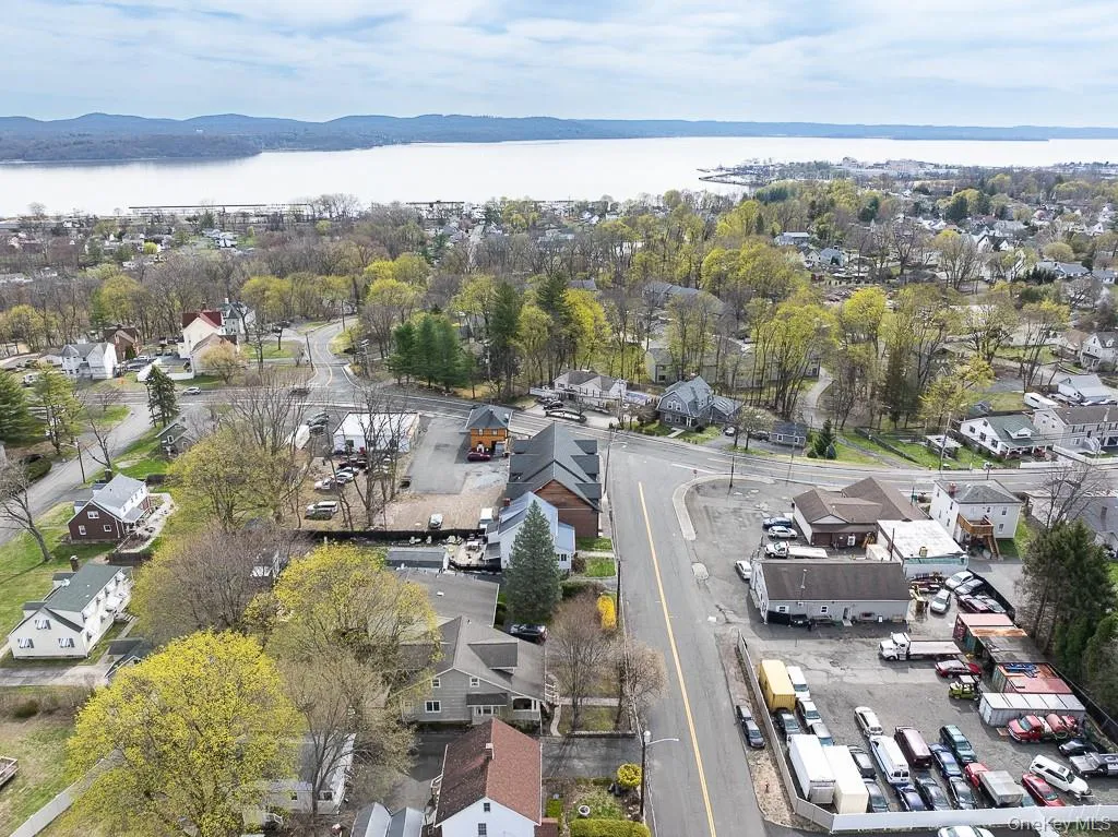 Birds eye view of property with a residential view and a water view Birds eye view of property with a residential view and a water view