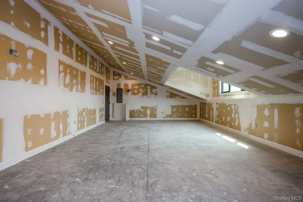 Additional living space with electric panel and recessed lighting Additional living space with electric panel and recessed lighting