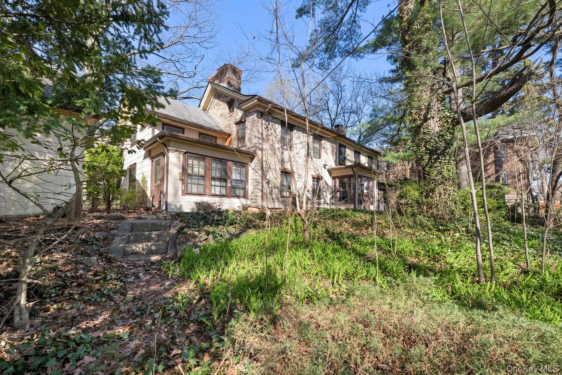 View of property exterior with a chimney View of property exterior with a chimney