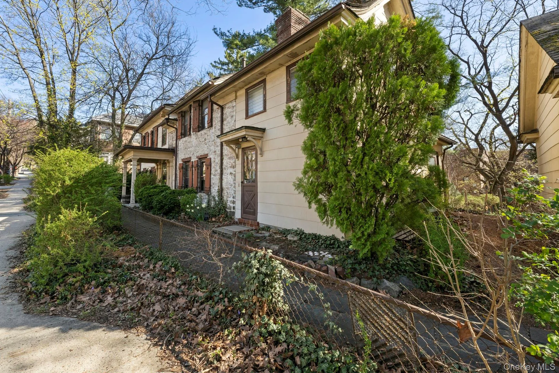 View of home's exterior featuring a fenced front yard View of home's exterior featuring a fenced front yard
