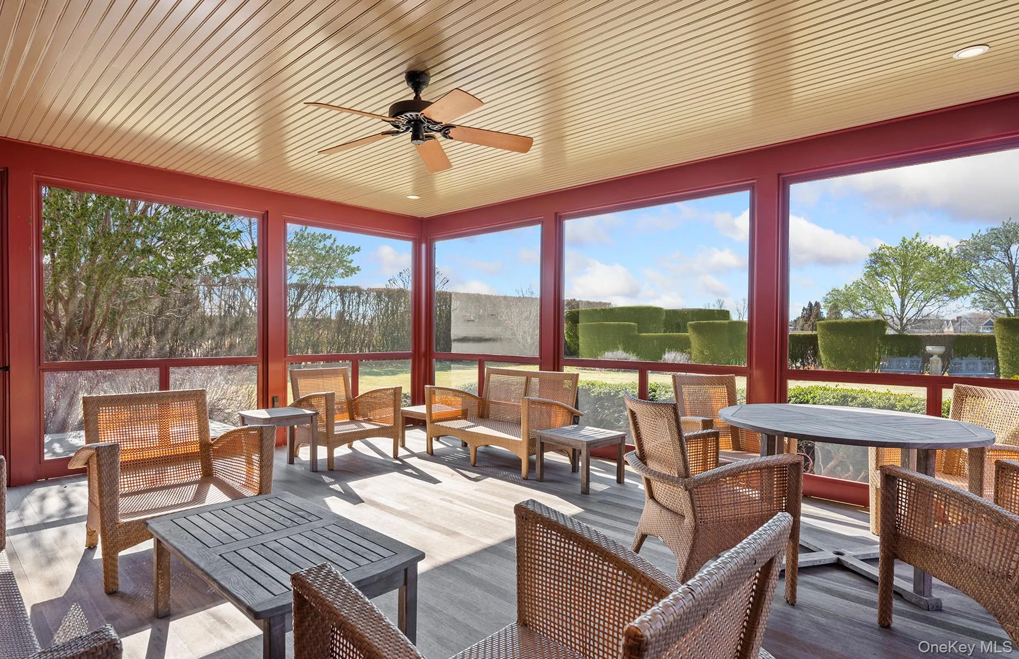 Sunroom with a ceiling fan, an outdoor hangout area, and a healthy amount of sunlight Sunroom with a ceiling fan, an outdoor hangout area, and a healthy amount of sunlight