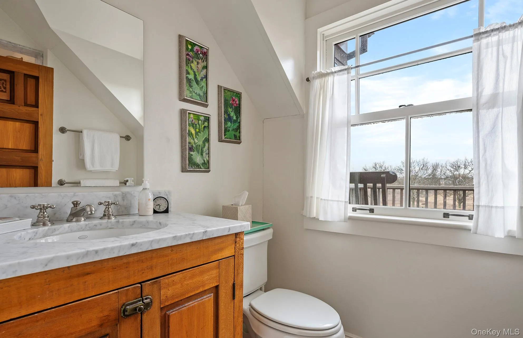 Half bath with toilet and vanity Half bath with toilet and vanity