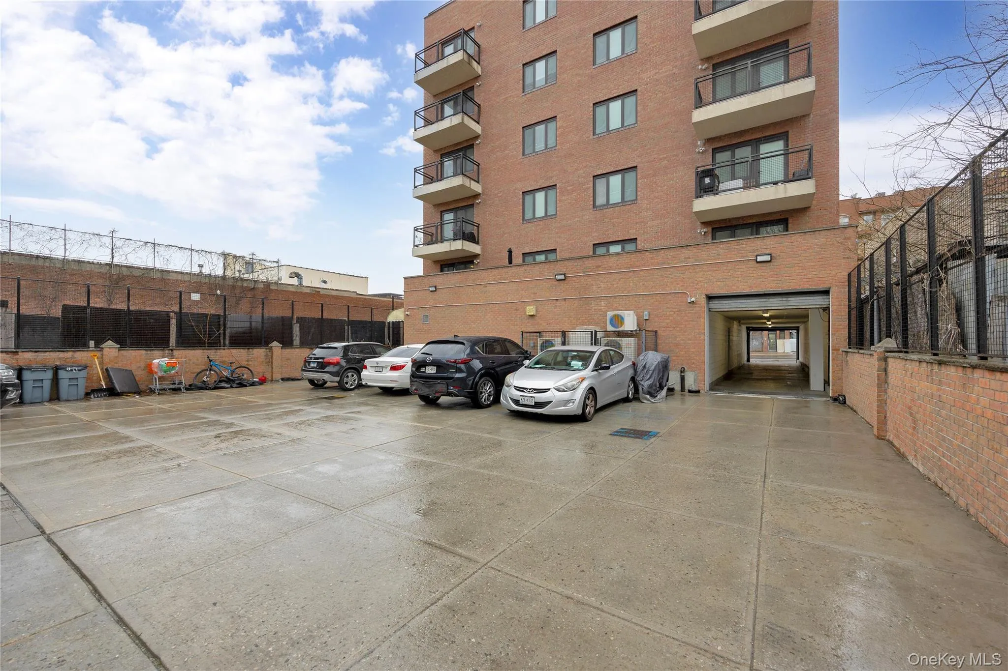 View of building exterior with uncovered parking View of building exterior with uncovered parking