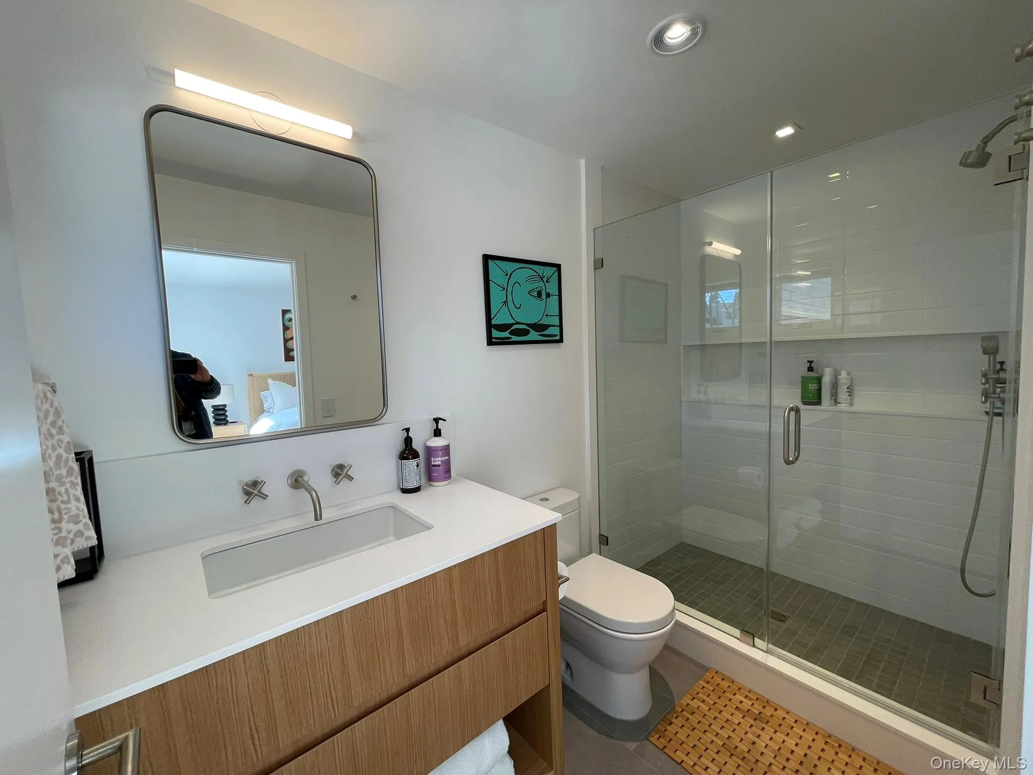 Bathroom featuring a shower stall, vanity, recessed lighting, toilet, and tile patterned floors Bathroom featuring a shower stall, vanity, recessed lighting, toilet, and tile patterned floors