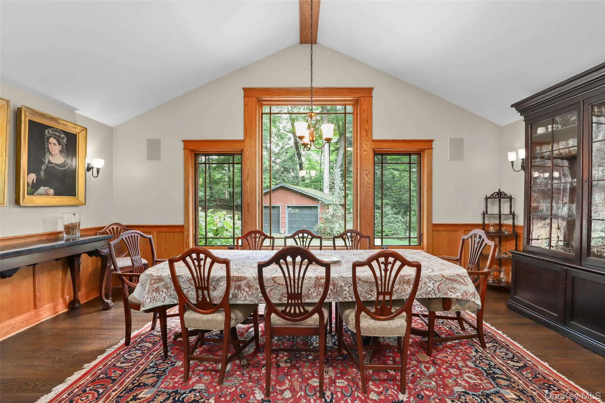 Formal Dining Area with large windows and view of fenced, wooded yard. Formal Dining Area with large windows and view of fenced, wooded yard.