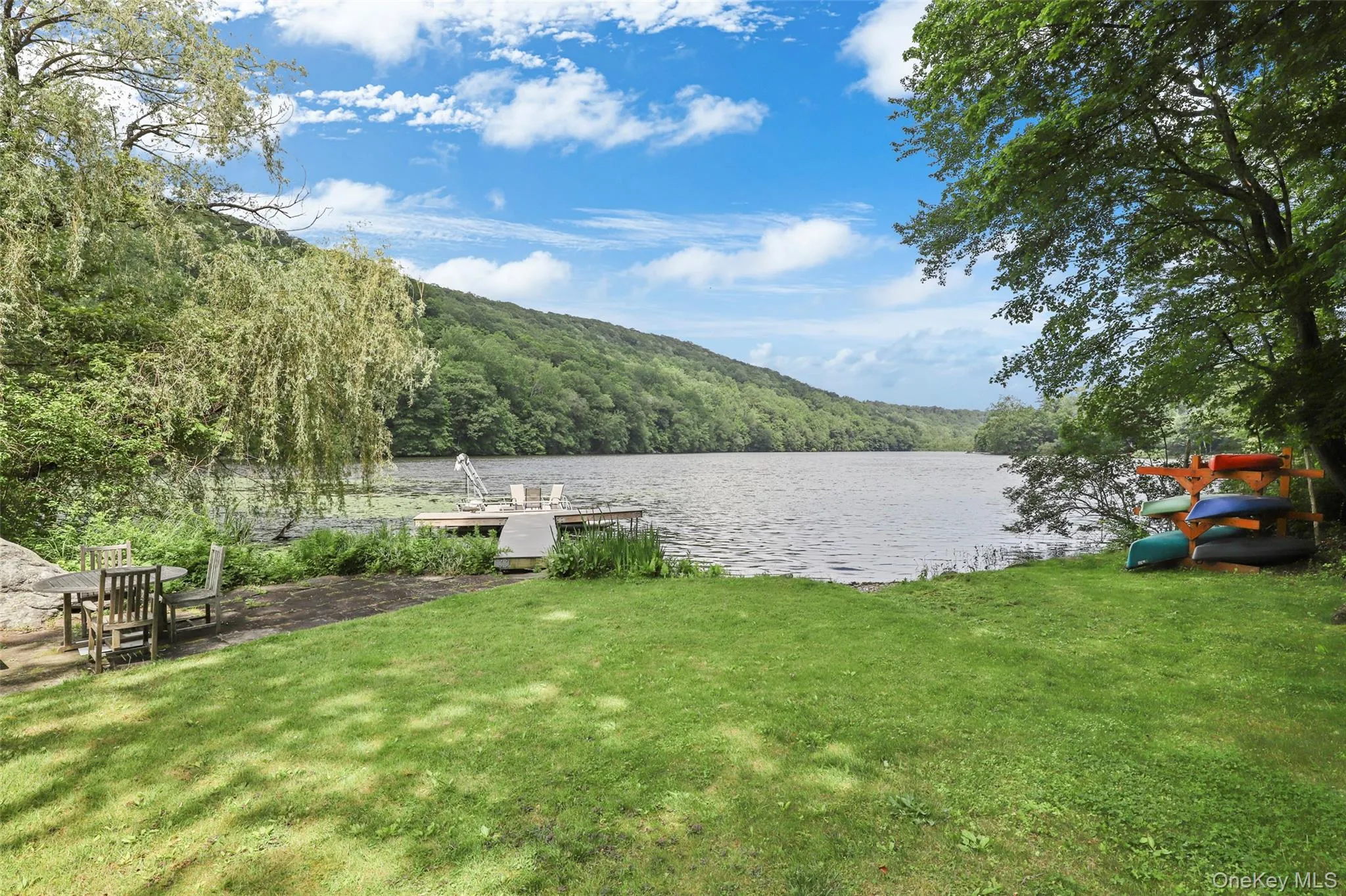 Home's private lakefront with view of Mountain Lakes Park. Home's private lakefront with view of Mountain Lakes Park.