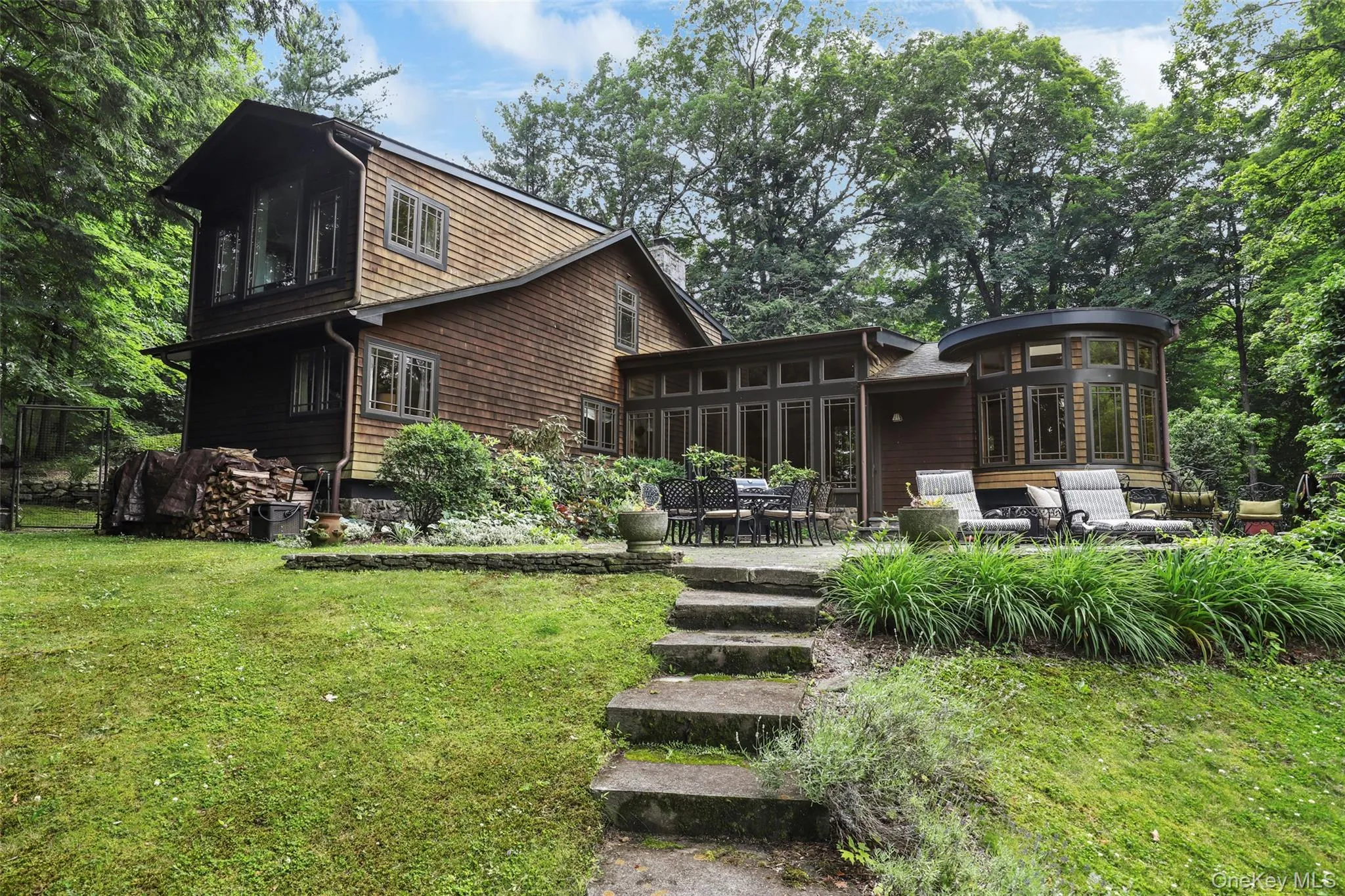 Back of house with a yard, a patio area, and an outdoor living space Back of house with a yard, a patio area, and an outdoor living space