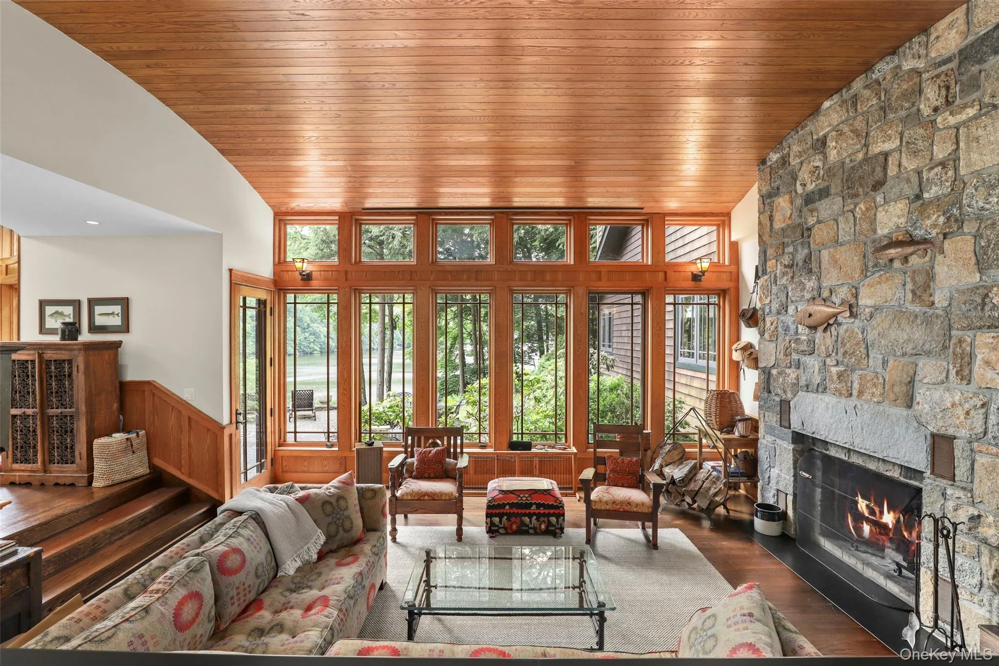 Living room featuring lots of natural light and plentiful seating areas Living room featuring lots of natural light and plentiful seating areas